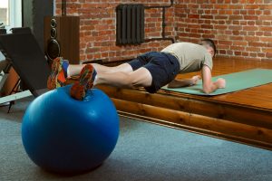 Enhancing Injury Prevention with Core Stability A man is performing a core stability at Utah Stretch and Flexibility