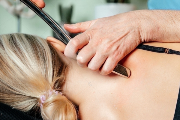 Patient getting Graston Technique at Utah Stretch and Flexibility